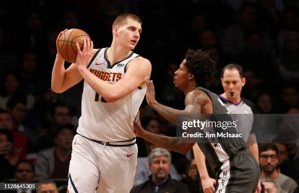 Nikola Jokic of the Denver Nuggets in action against Ed Davis of the Brooklyn Nets at Barclays Center on February 6, 2019 in the Brooklyn borough of...