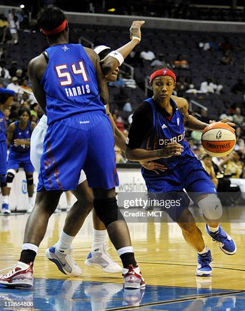 Detroit Shock guard Deanna Nolan, right, drives around a screen set by teammate Barbara Farris during the fourth quarter against the Washington...