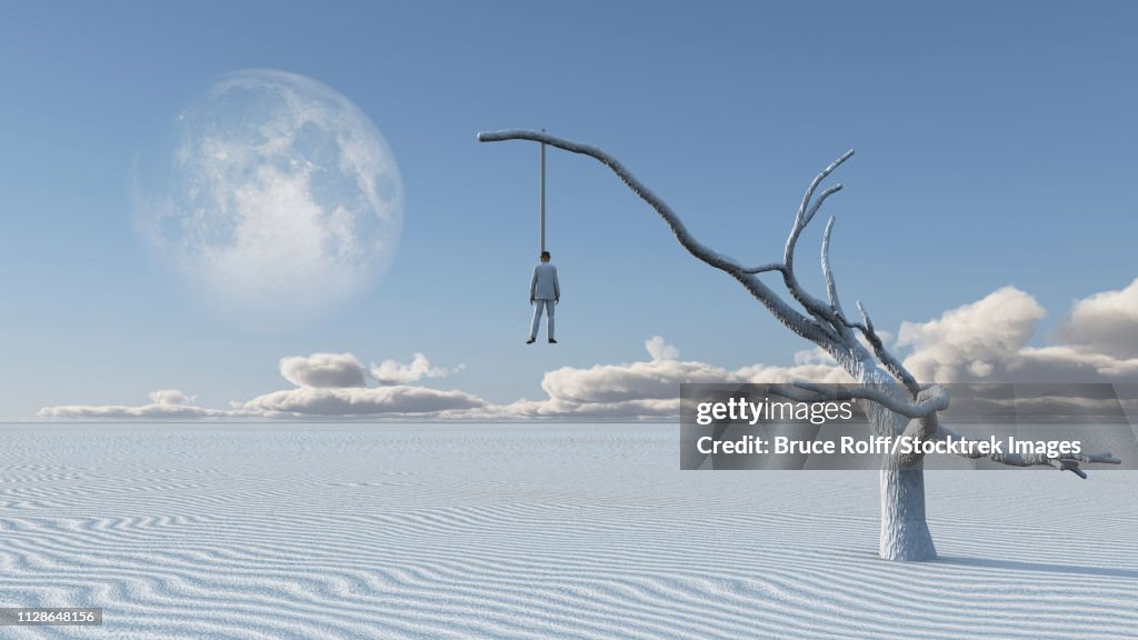 Surreal white desert. Man in white suit is hanged on a dry tree.