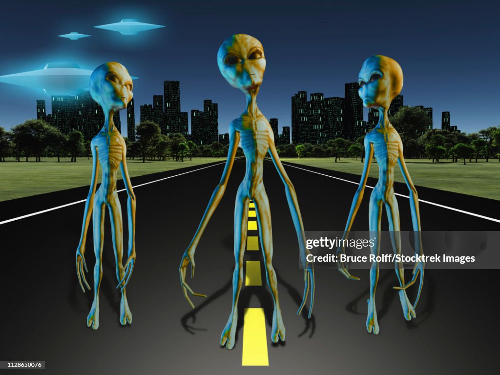 Aliens on road to city. UFO