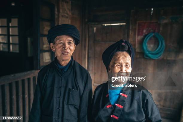 smiling old  chinese minority couple - yao tribe stock pictures, royalty-free photos & images