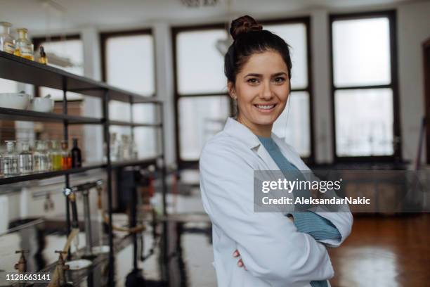 portrait of smiling chemist - woman scientist stock pictures, royalty-free photos & images