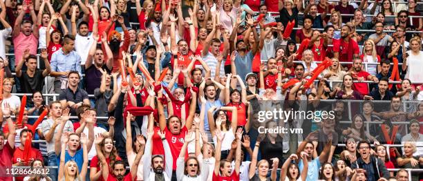 people on a stadium cheering their team - crowd shouting stock pictures, royalty-free photos & images