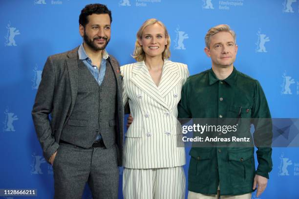 Cas Anvar, Diane Kruger and Martin Freeman pose at the "The Operative" photocall during the 69th Berlinale International Film Festival Berlin at...