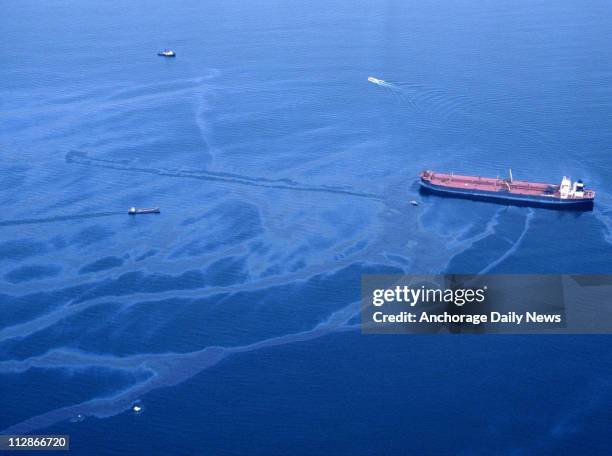 Oil spills from the crippled tanker Exxon Valdez the morning of March 24 after the vessel ran aground on Bligh Reef in Prince William Sound.