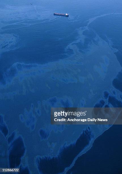Oil spills from the crippled tanker Exxon Valdez March 24 after the vessel ran aground on Bligh Reef in Alaska's Prince William Sound. The spill of...