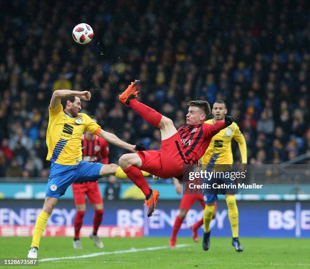 Stephan Fuerstner of Eintracht Braunschweig and Florian Hansch of SV Wehen Wiesbaden battle for the ball during the 3. Liga match between Eintracht...