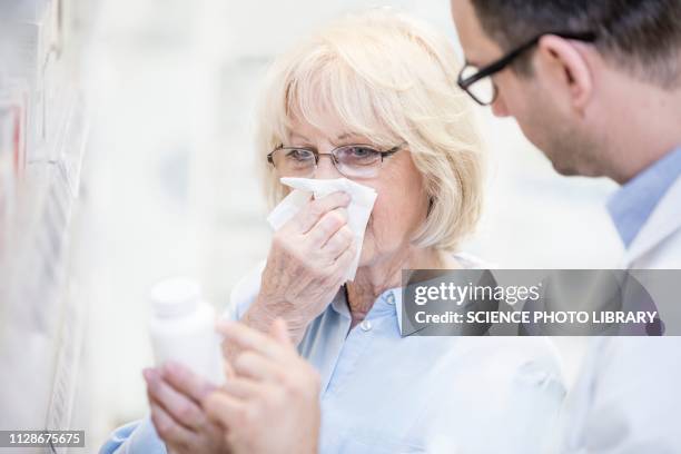 pharmacist talking to customer - allergy doctor stockfoto's en -beelden
