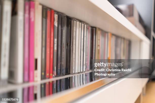 stack of cds in sideboard - cd ストックフォトと画像
