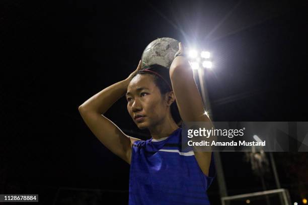 Akha/Thai Woman Soccer Player Throwing a Ball