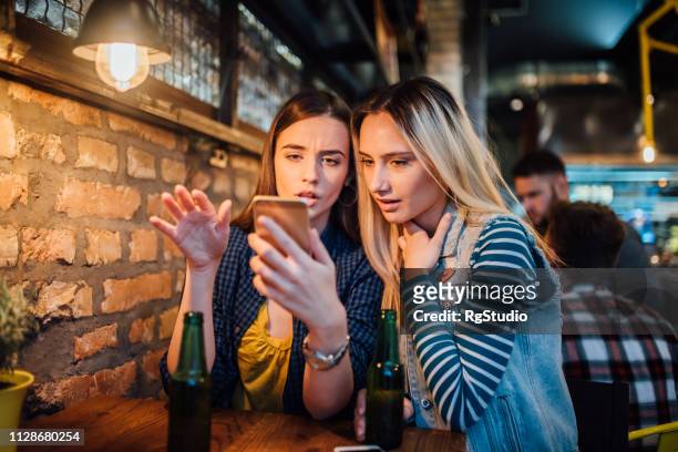 girls using mobile phone - international womens day 2019 stock pictures, royalty-free photos & images