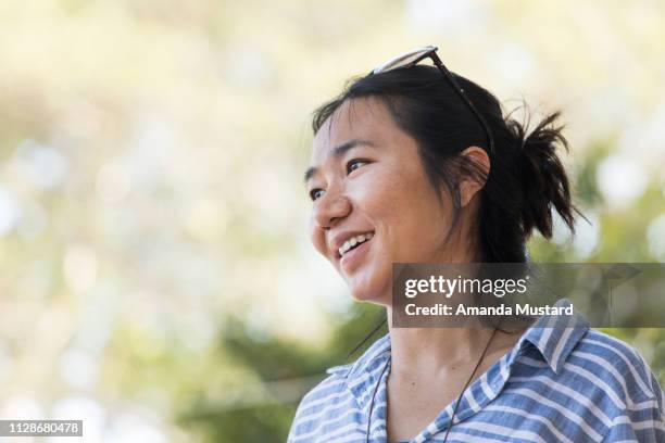 portrait of female asian social worker in local community - akha woman stock pictures, royalty-free photos & images