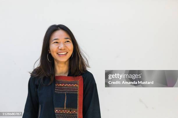 beautiful akha/thai woman smiling wearing hill tribe textile jacket - akha woman stock pictures, royalty-free photos & images