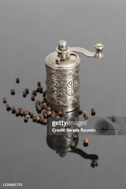 black peppercorns and pepper mill - black pepper stock pictures, royalty-free photos & images