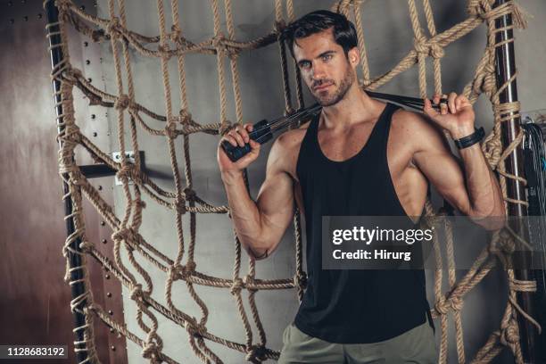 athlete holding resistance band - blue eyes stock pictures, royalty-free photos & images