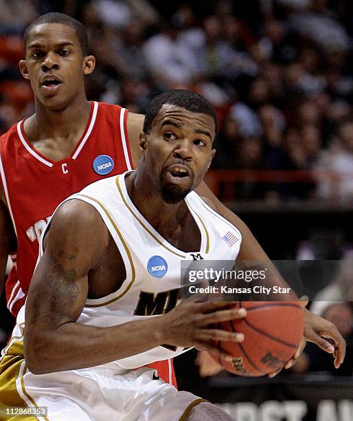 Missouri guard Zaire Taylor eyed the basket as Cornell guard Louis Dale tried to defend during the first half of an opening round game in the 2009...