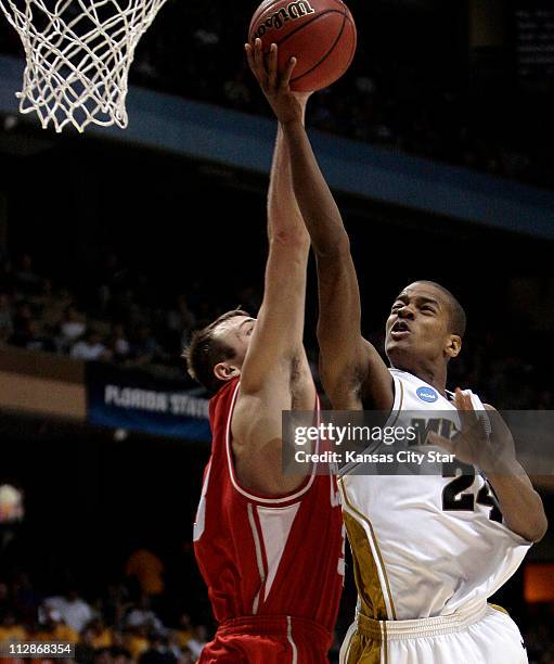 Cornell center Jeff Foote fouls Missouri guard Kim English during a lay-up attempt in the second half of a first round game in the 2009 NCAA Division...