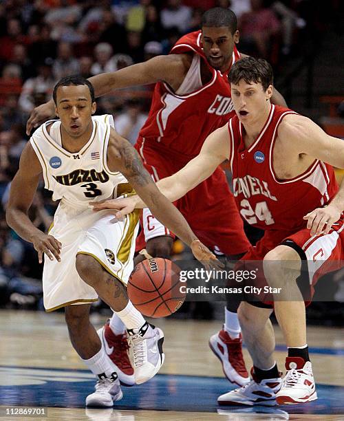 Missouri guard Miguel Paul takes off ahead of Cornell's Adam Wire and Jason Battle after picking up a loose ball during game action in the first...