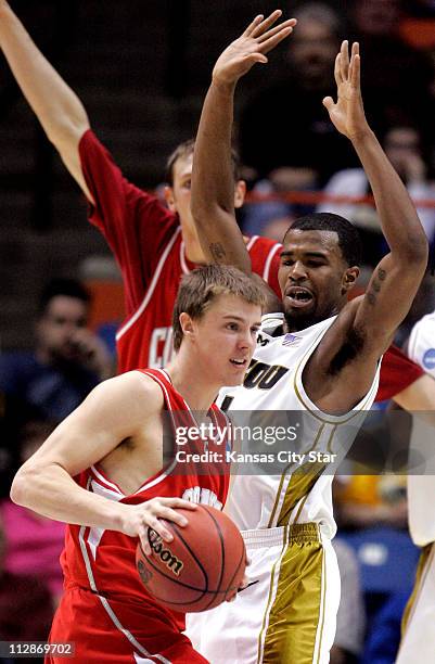 Cornell guard Geoff Reeves looks for a passing lane as Missouri guard Zaire Taylor defends during first round game action in the 2009 NCAA Division I...