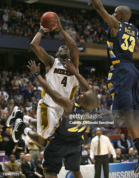 Missouri's J.T. Tiller draws the foul from Marquette's Jerel McNeal during the final minute of their 83-79 victory over the Golden Eagles in the...