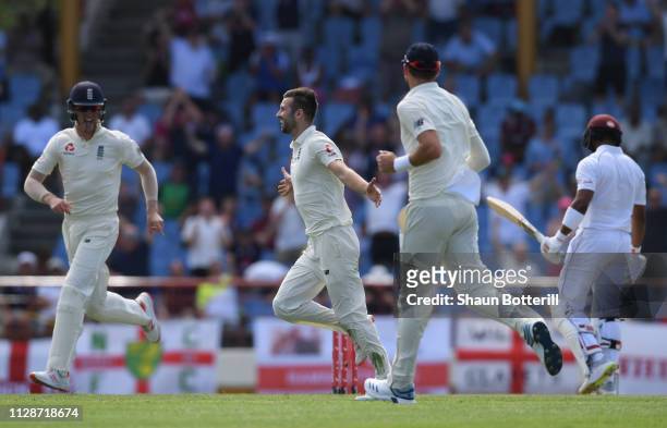 Mark Wood of England celebrates after taking the wicket of Darren Bravo of West Indies during Day Two of the Third Test match between the West Indies...