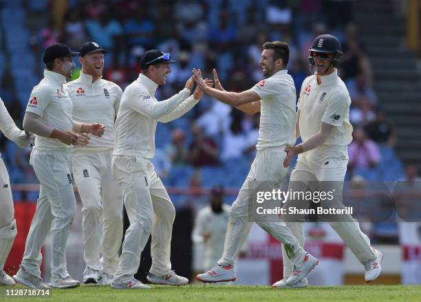 Mark Wood of England celebrates after taking the wicket of Darren Bravo of West Indies during Day Two of the Third Test match between the West Indies...