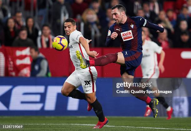 Wissam Ben Yedder of Sevilla FC competes for the ball with Ivan Ramis Barrios of SD Eibar during the La Liga match between Sevilla FC and SD Eibar at...