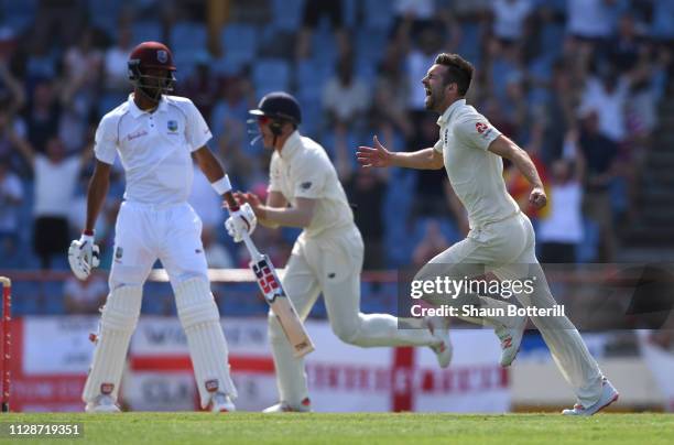 Mark Wood of England celebrates after taking the wicket of Roston Chase of West Indies during Day Two of the Third Test match between the West Indies...