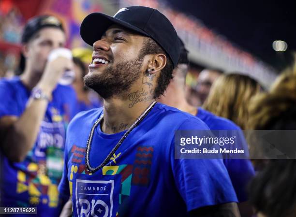 Brazilian football player Neymar attends the parade of the Paraiso do Tuiuti samba school performance during the parade at 2019 Brazilian Carnival at...