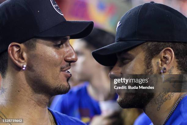 Brazilian football player Neymar and Brazilian professional surfer Gabriel Medina attend the parade of the Paraiso do Tuiuti samba school performance...