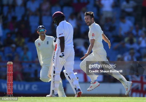 Mark Wood of England celebrates after taking the wicket of Darren Bravo of West Indies during Day Two of the Third Test match between the West Indies...