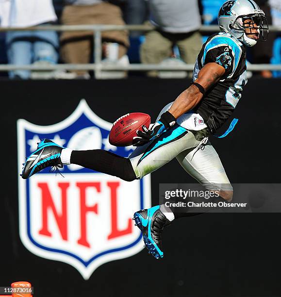 Carolina Panthers wide receiver Steve Smith leaps into the end zone for a touchdown against the Arizona Cardinals at Bank of America Stadium in...