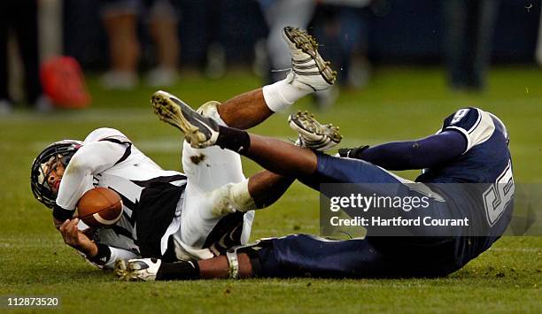 Connecticut's Lindsey Whitten sacks Cincinnati's Chazz Anderson in the fourth quarter at Rentschler Field on Saturday, October 25 in East Hartford,...