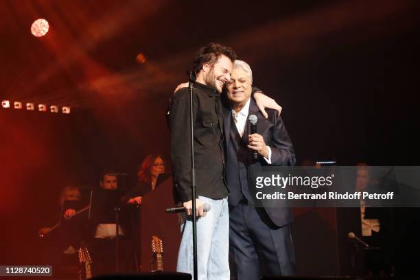 Amir and Enrico Macias perform for Enrico Macias 80th Anniversary at L'Olympia on February 10, 2019 in Paris, France.