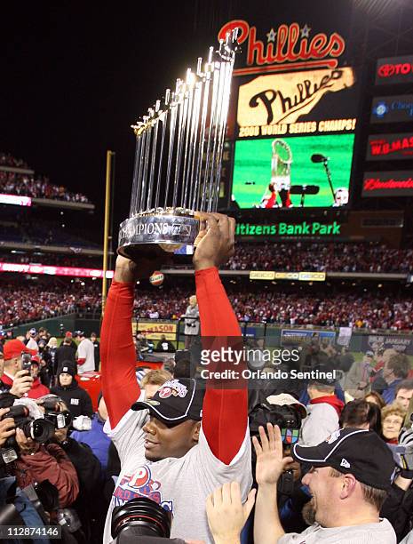 Philadelphia Phillies first baseman Ryan Howard holds up the trophy after the Phillies won the World Series with a 4-3 victory over the Tampa Bay...