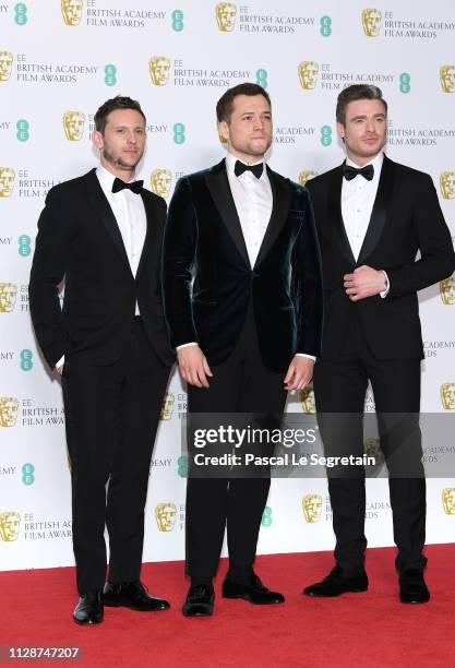 Jamie Bell, Taron Egerton and Richard Madden pose in the press room during the EE British Academy Film Awards at Royal Albert Hall on February 10,...