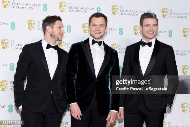 Jamie Bell, Taron Egerton and Richard Madden pose in the press room during the EE British Academy Film Awards at Royal Albert Hall on February 10,...