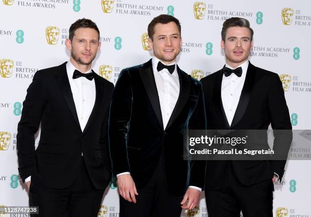 Jamie Bell, Taron Egerton and Richard Madden pose in the press room during the EE British Academy Film Awards at Royal Albert Hall on February 10,...