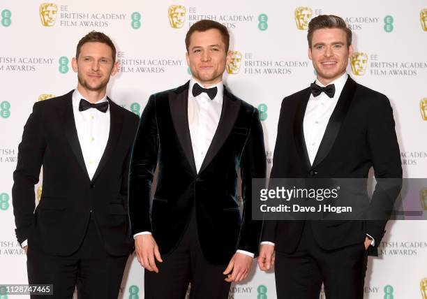 Jamie Bell, Taron Egerton and Richard Madden pose in the press room during the EE British Academy Film Awards at Royal Albert Hall on February 10,...