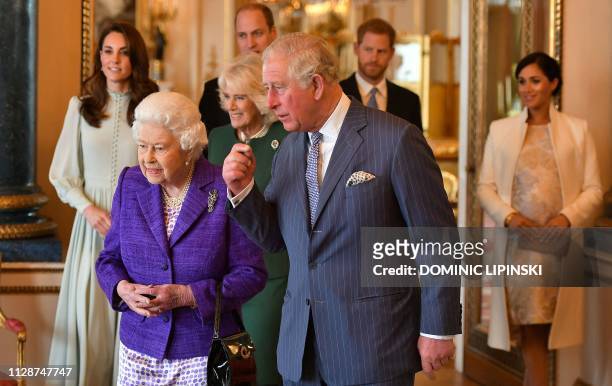 Britain's Prince Charles, Prince of Wales walks with his mother Britain's Queen Elizabeth II , and his wife Britain's Camilla, Duchess of Cornwall ,...