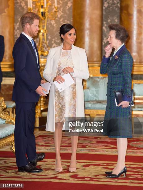 Prince Harry, Duke of Sussex, Meghan, Duchess of Sussex and Princess Anne, Princess Royal attend a reception to mark the fiftieth anniversary of the...