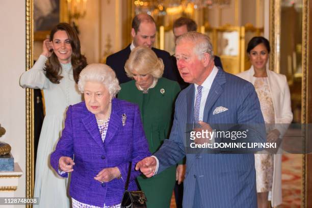 Britain's Catherine, Duchess of Cambridge, Britain's Queen Elizabeth II, Britain's Prince William, Duke of Cambridge, Britain's Camilla, Duchess of...