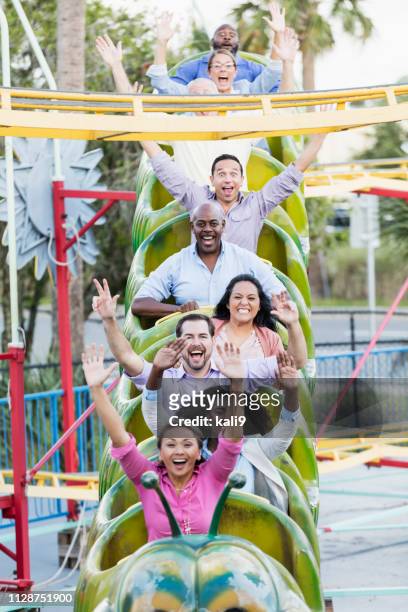 corporate team building on amusement park rollercoaster - young woman screaming on a rollercoaster stock pictures, royalty-free photos & images