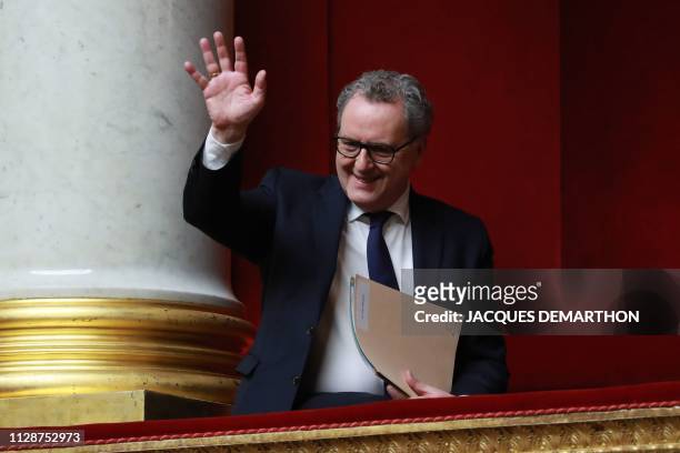 French National President Richard Ferrand waves to his vice president as she chairs a session of questions to the Government at the French National...