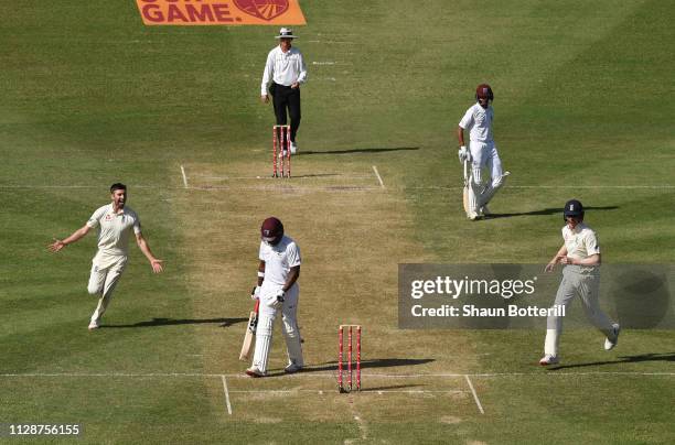 Mark Wood of England celebrates after taking the wicket of Darren Bravo of West Indies during Day Two of the Third Test match between the West Indies...