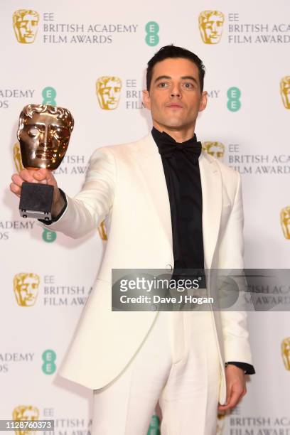 Rami Malek, winner of Best Actor for the film Bohemian Rhapsody poses with his award in the press room during the EE British Academy Film Awards at...