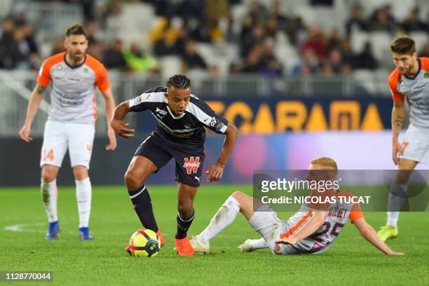Bordeaux's French defender Jules Kounde vies with Montpellier's French midfielder Florent Mollet during the French L1 football match between FC...