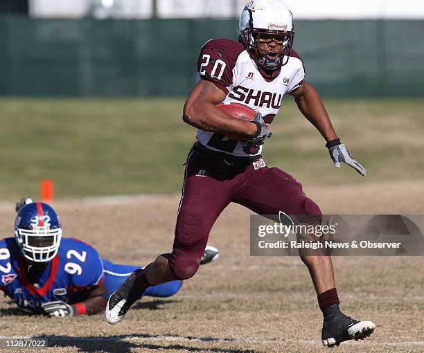 Shaw University's Raymond Williams breaks past Elizabeth City State's Malcolm Jenkins during the first half of the CIAA football championship game...