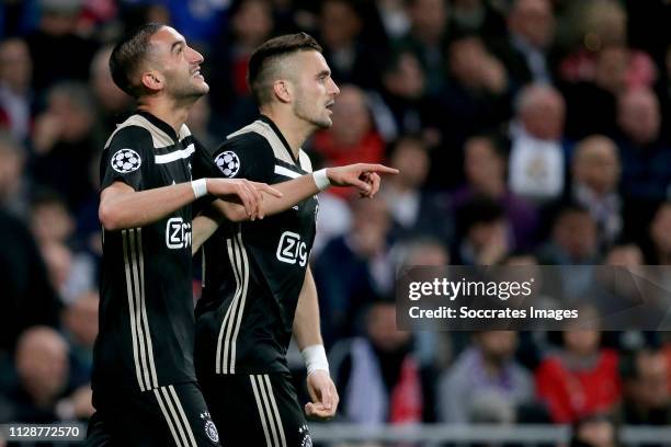 Hakim Ziyech of Ajax celebrates 0-1 with Dusan Tadic of Ajax during the UEFA Champions League match between Real Madrid v Ajax at the Santiago...