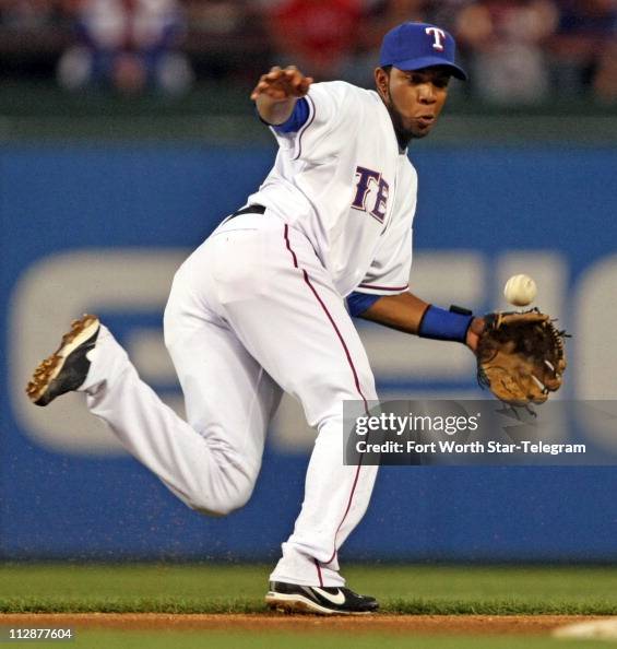Texas Rangers Andrus Texas Rangers shortstop Elvis Andrus tries to get to a fast moving ...
